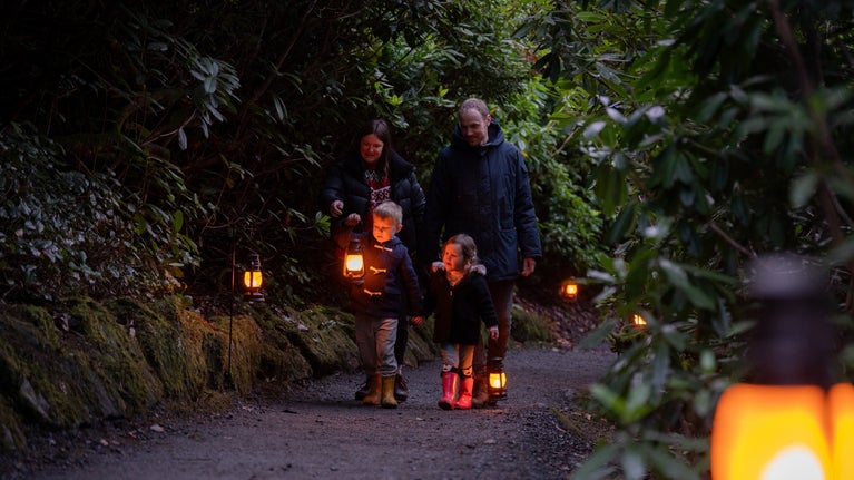 A family enjoying a lantern walk